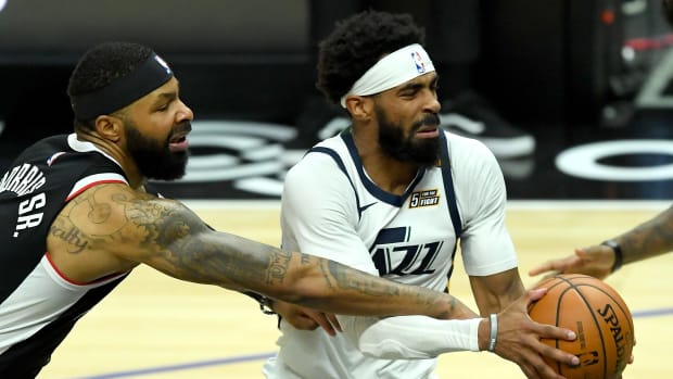 Feb 19, 2021; Los Angeles, California, USA; Los Angeles Clippers forward Marcus Morris Sr. (8) defends Utah Jazz guard Mike Conley (10) as he drives to the basket in the second half of the game at Staples Center. Mandatory Credit: Jayne Kamin-Oncea-USA TODAY Sports